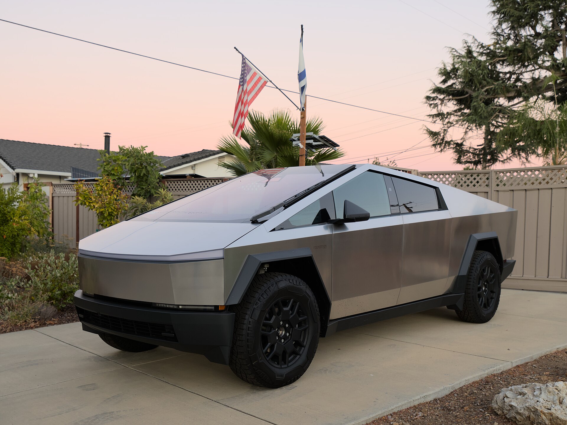 A Tesla Cybertruck on the road — one of the EV threads in this weekend's Reddit roundup.