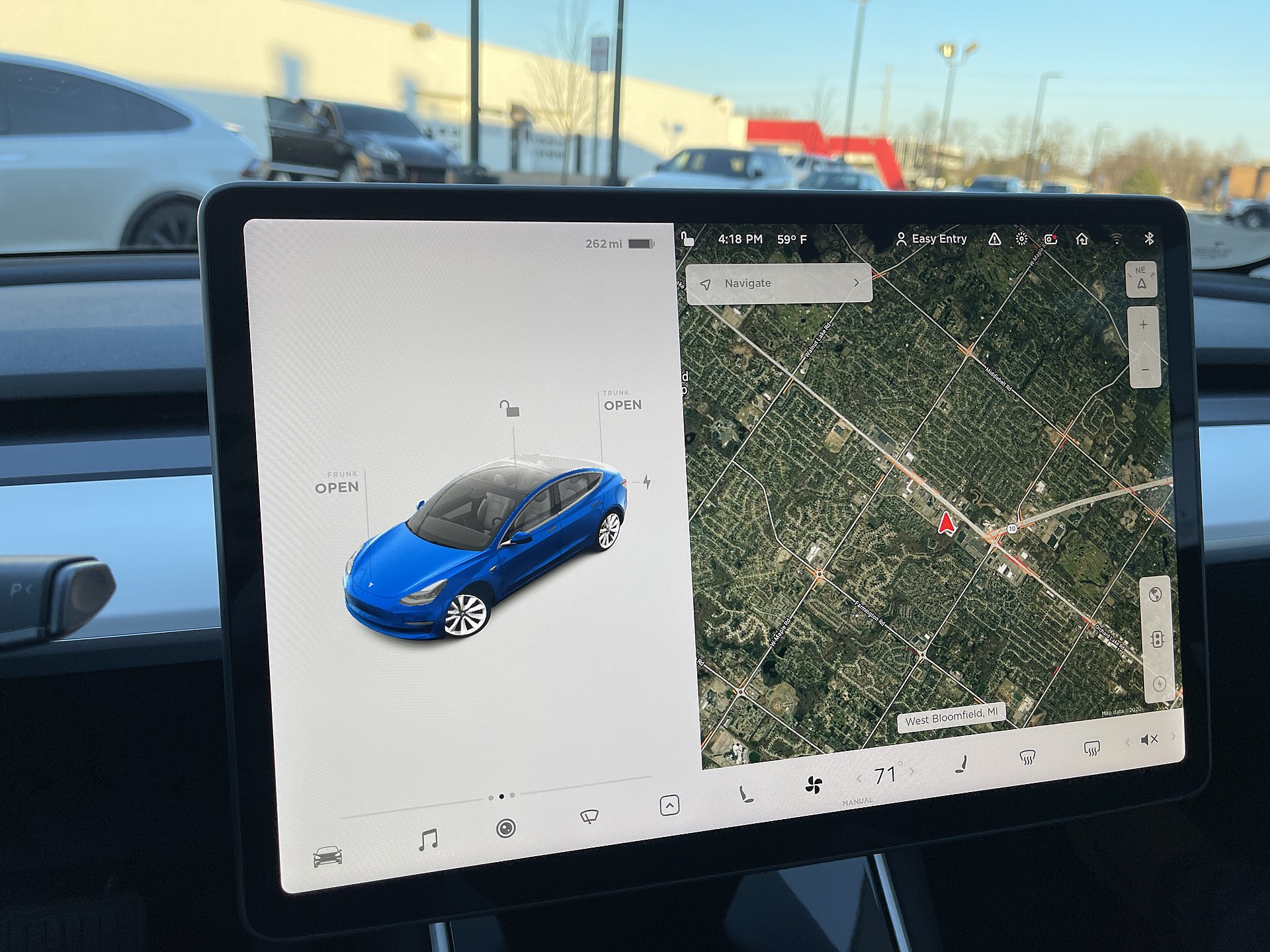 The touchscreen-heavy cabin of a modern electric car — where complexity has moved indoors.