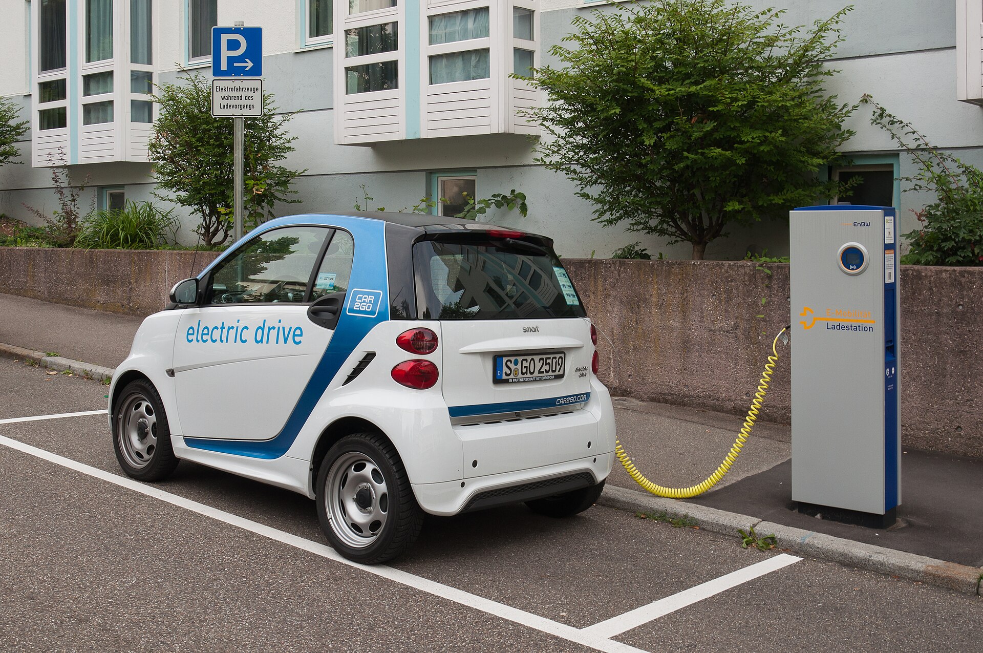 An electric car charging at a public station in Stuttgart, Germany.