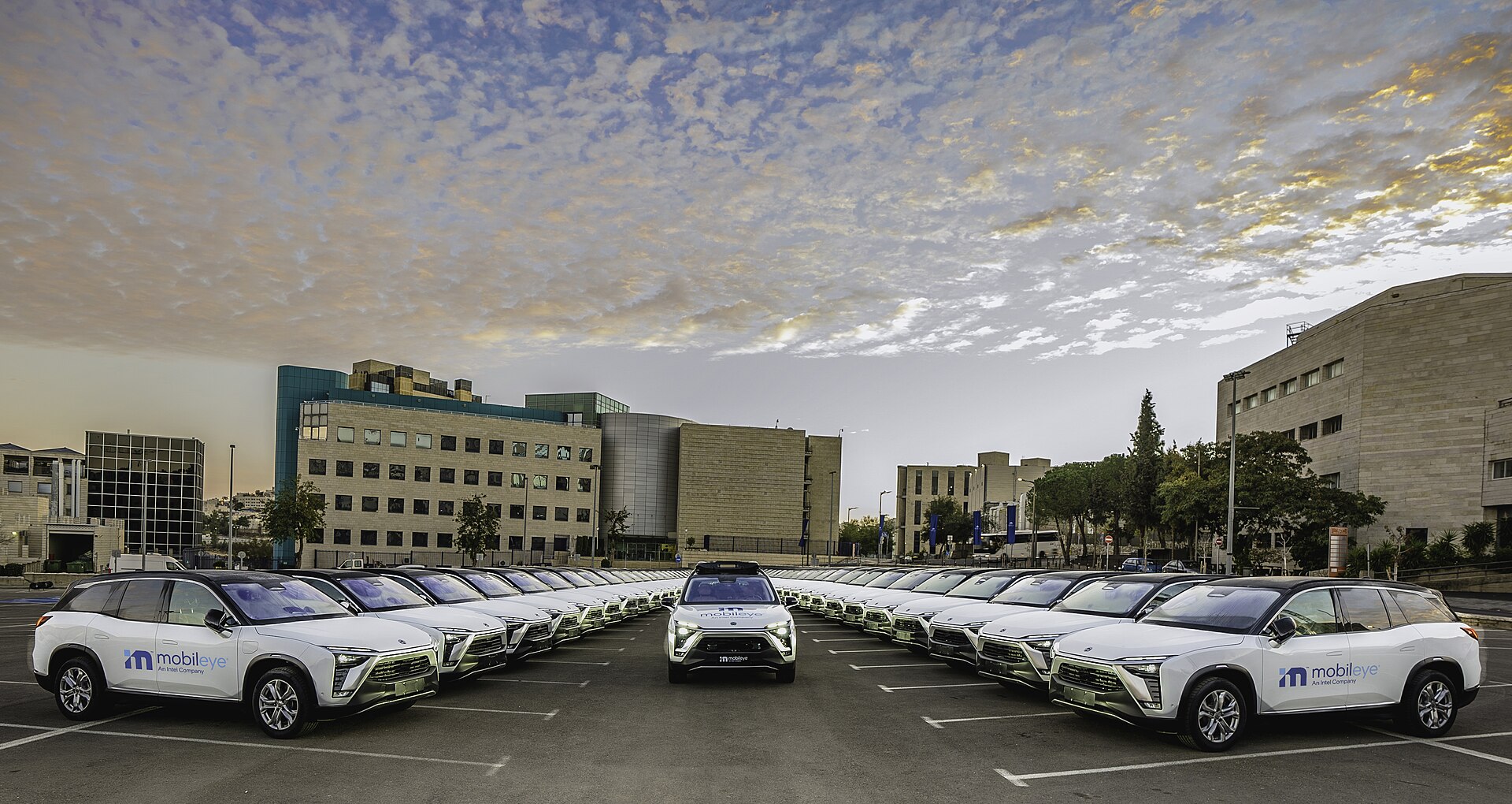 A fleet of Mobileye branded autonomous vehicles parked in Jerusalem.