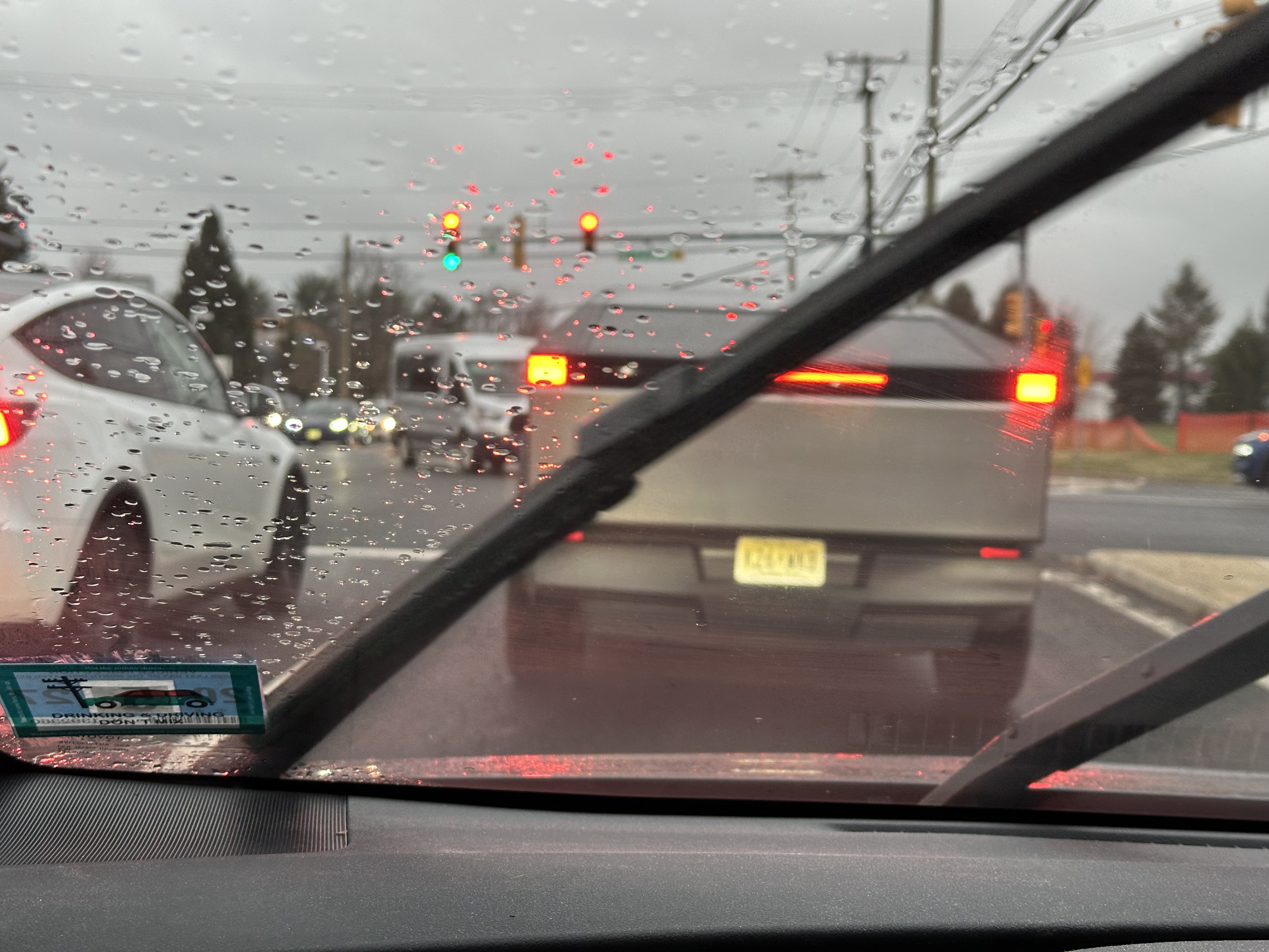 A Tesla Cybertruck in heavy rain.